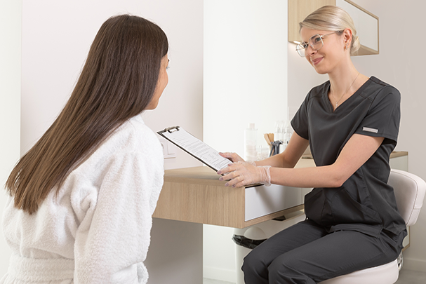 Dermatology provider discussing dandruff with patient