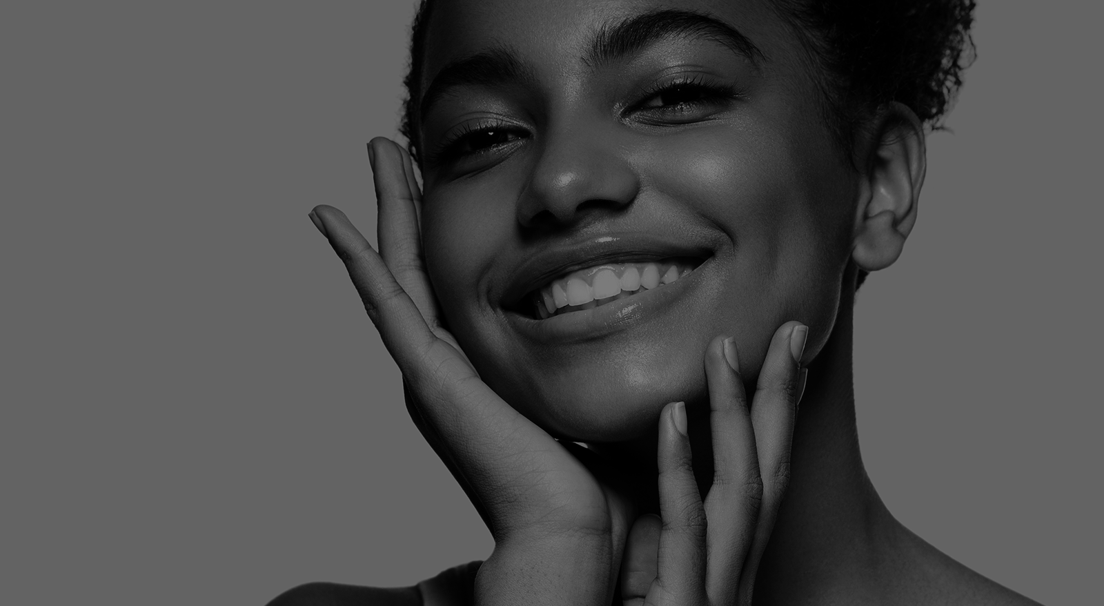 Close-up of radiant skin and confident smile after dermatology treatment