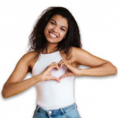 Woman in white tank top putting her hands into a heart shape.